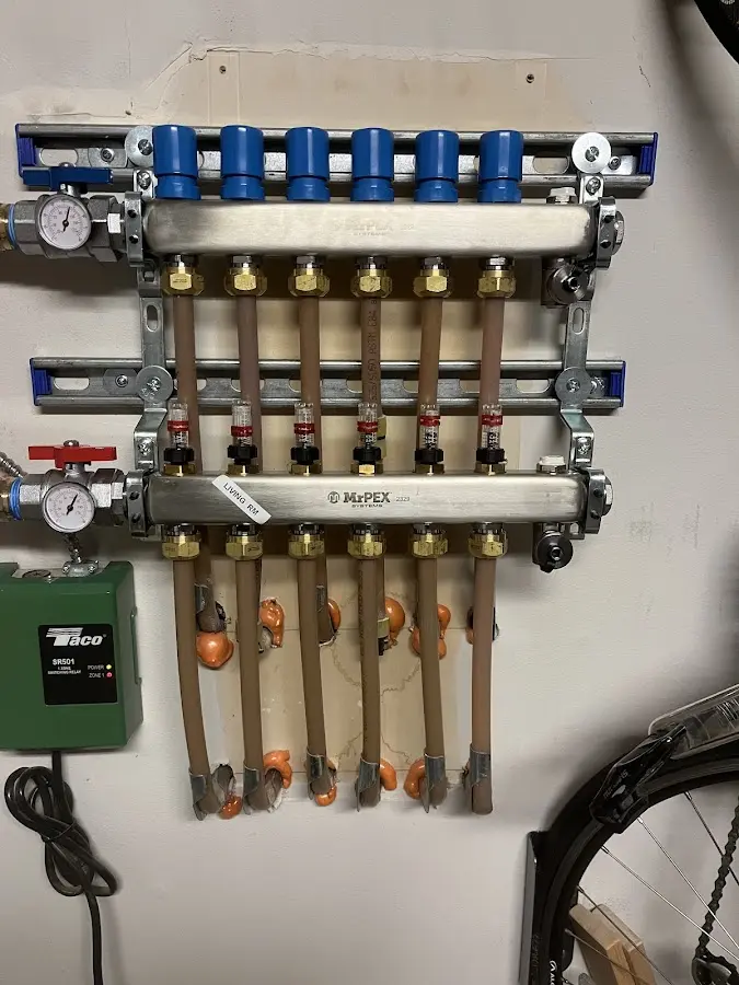 Plumber performing Water Heater Repair at a residential property in Topsham